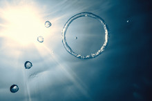 Bubble Ring Underwater Ascends Towards The Sun.