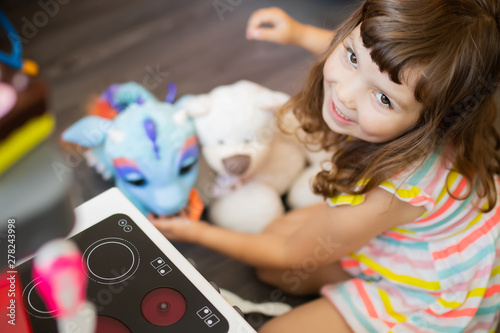 little girl play dishes