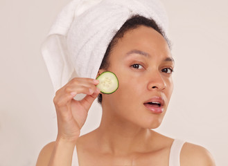 Wall Mural - Young Woman use cucumber slices to treat dark circles , fresh clean skin. Home Skin care treatments, Natural Beauty