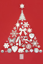 Abstract Christmas Tree Decoration With Baubles, Ornaments And Symbols On Red Background. Traditional Theme With Symbols For The Festive Season.