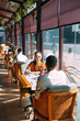 © davit85 - A young couple drinking wine in a restaurant near the window.