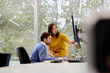 © ALTO IMAGES/Stocksy - Business Colleagues Discussing Over Computer