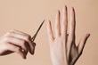 © Lumina/Stocksy - Woman Holding Nail Scissors