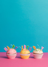 Cupcake With Birthday Candle On A Blue Background