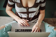© Ilya/Stocksy - Young anonymous woman using laptop