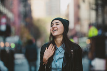 Happy Young Woman In Beanie