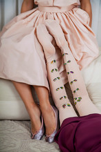 Female Legs In A Pink Dress