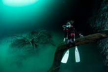 Scuba Diver In Cave Under River