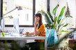 © ALTO IMAGES/Stocksy - Smiling Businesswoman Looking Away At Desk