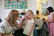 © Rob and Julia Campbell/Stocksy - Teacher consoling upset student