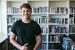© Rob and Julia Campbell/Stocksy - Teen portrait in library