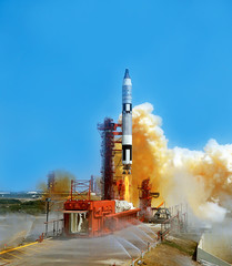 Wall Mural - launch of the spaceship from the spaceport by day. space shuttle in clouds of smoke on the backgroun