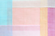 Traditional patchwork background of ramie fabric. Pastel tone.
