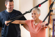 © Microgen - Senior Woman Exercising on TRX