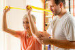 © Microgen - Senior Woman Exercising With Rubber Band