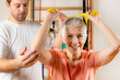 © Microgen - Senior Woman Exercising With Rubber Band