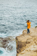 © phpetrunina14 - man photographer taking picture on camera standing at the edge of the cliff