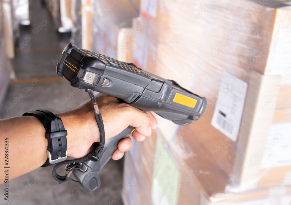 worker is scanning barcode scanner with cargo shipment. Stock Photo ...