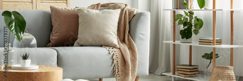 Close-up of gray comfortable sofa in modern apartment - panorama Poster Mural XXL
