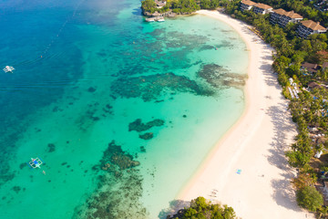 Beautiful Punta Bunga Beach on Boracay island, Philippines. White sandy beach and beautiful lagoon with coral reefs. The coast of the island of Boracay for tourists.