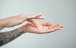 © Artem Markin - Fingers apply cream to skin. Close up
