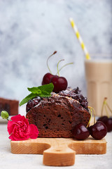 Chocolate brownie cake with cherries. Delicious homemade sweet dessert. 