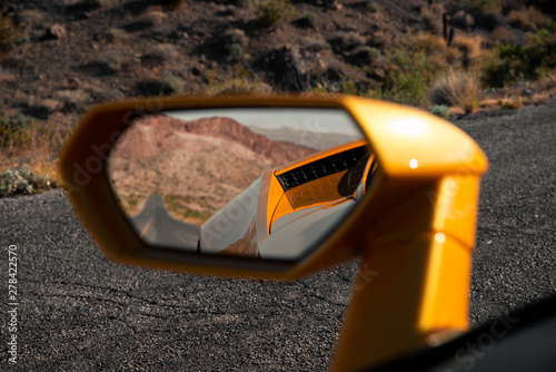 Fotografía Empty Road Visible in Sports Car Mirror
