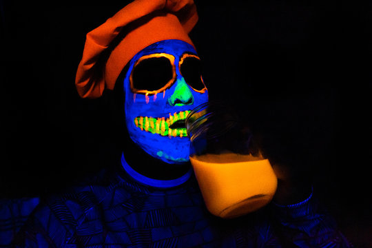 Man with neon makeup for a Neon Party For halloween