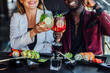© Тарас Нагирняк - Close up photo. Drinking mojito with sushi in summer terrace.