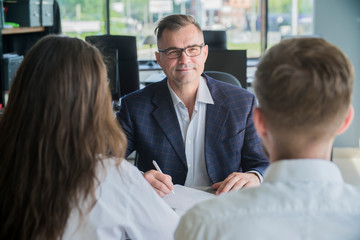 Wall Mural - Couple meeting with financial advisor. Businessman with customers