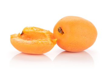 Group of one whole one half of fresh deep orange apricot isolated on white background