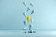 A Yellow Light bulb Floating among blue light bulbs from hole. Idea concept Creative. 3D render