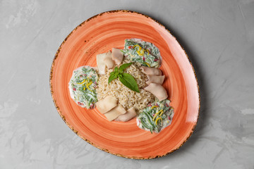 Wall Mural - Squid with brown rice and cucumber in yogurt dressing. The view from the top. Copy-space.