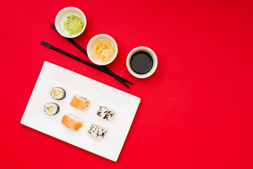 Wall Mural - Asian rolls on plate with different sauces and marinated ginger in bowl