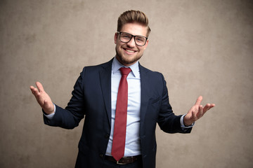 Canvas Print - Joyful businessman welcoming with his arms wide open