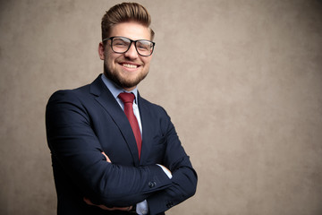 Jolly businessman laughing with his hands crossed