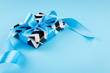 Wall Mural - gift box on a blue background