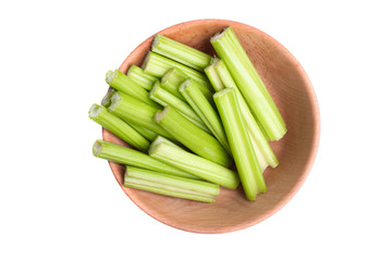 Poster - sliced celery in deep wooden bowl