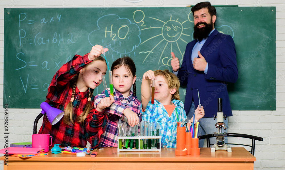 Little kids learning chemistry in school laboratory. school kids ...