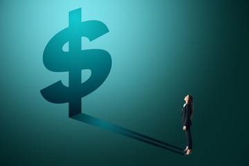 Wall Mural - Businesswoman looking at dollar shadow