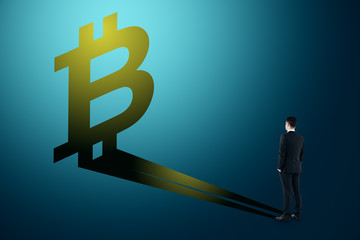 Poster - Businessman looking at bitcoin shadow