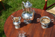 Vintage Silver Tea Set On A Brown Wooden Table, Closeup