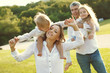 © nuzza11 - Family in nature. Parents with children have fun playing.