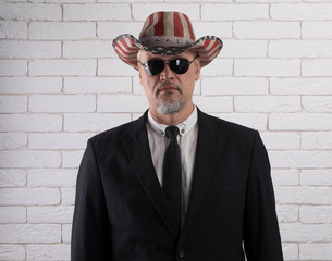 Canvas Print - closeup portrait of an old gentleman, white brick wall