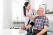 © leszekglasner - Nurse visiting senior male at home doing blood pressure measurement
