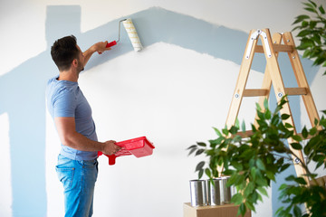 Rear view of man while doing some housework