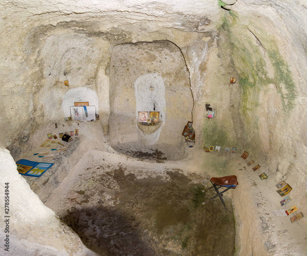 ancient cell in a cave in Eski kermen with icons Stock Photo | Adobe Stock
