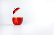 Health Red Cut Apple floating top slice juice drink idea concept on white background