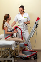 Nurse with young disabled patient in clinic.