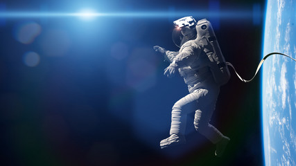 astronaut performing a spacewalk in orbit of planet earth